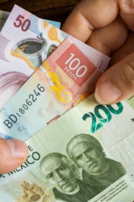 Monex advierte presiones al peso por tasas altas de Banxico y Fed