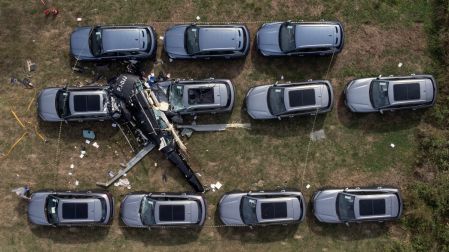 An aerial view shows the site of a helicopter crash in the Recreio dos Bandeirantes neighbourhood, in Rio de Janeiro, Brazil, on June 14, 2026. At least six people died in Brazil on June 14 after two helicopters crashed in western Rio de Janeiro, after a suspected mid-air collision, firefighters said. (Photo by Tercio TEIXEIRA / AFP)